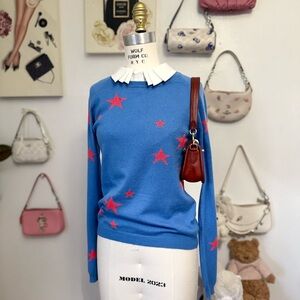 Cinti Parker Elegant Blue Sweater with Red Star Accents